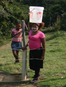 village-lady-carrying-water-wild-coast-eastern-cape